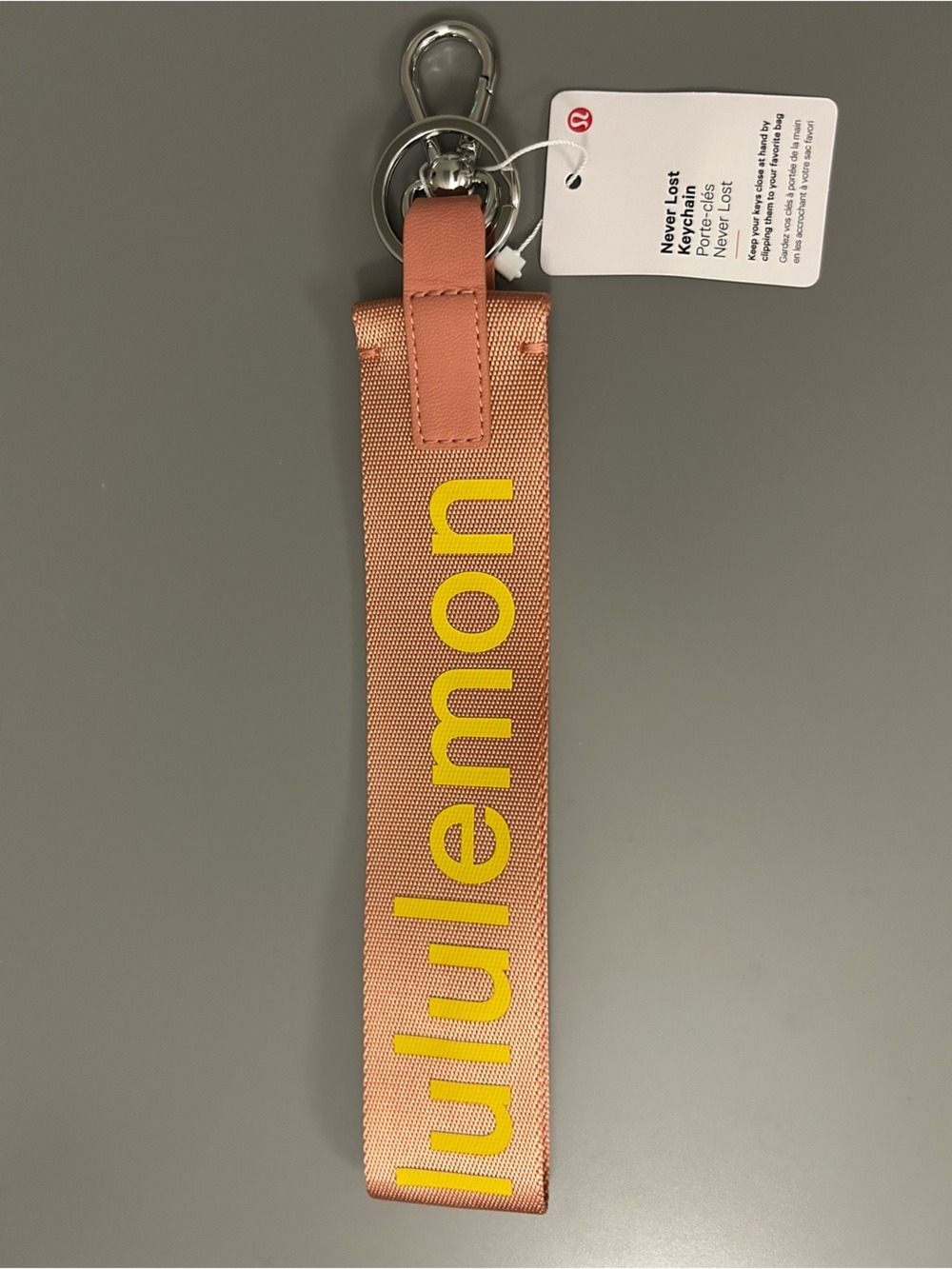 Lululemon Never Lost Keychain NWT Coral Key Fob Strap with Yellow Logo - Picture 2 of 4